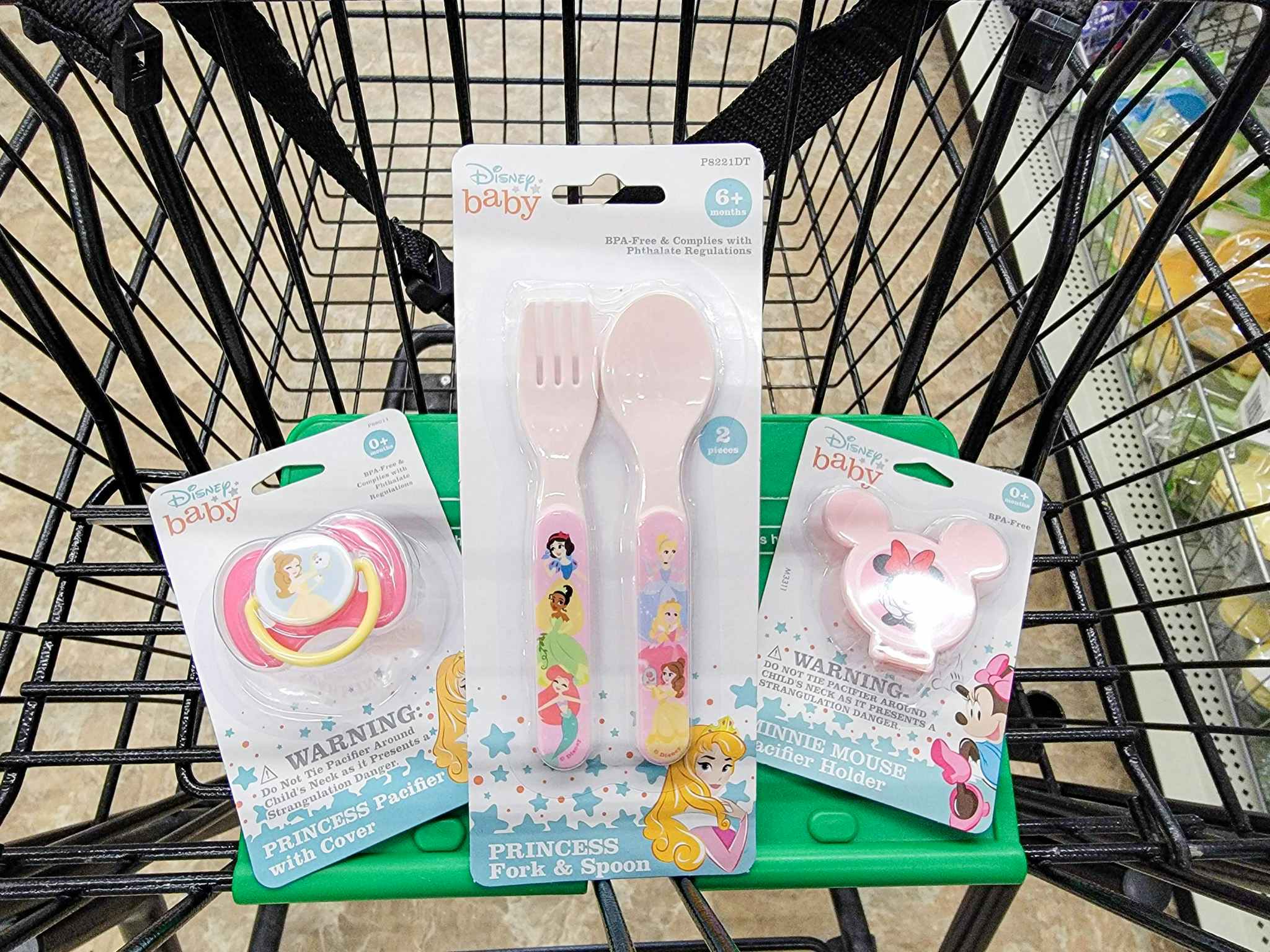 disney baby pacifier clip, pacifier, and fork & spoon set in a cart