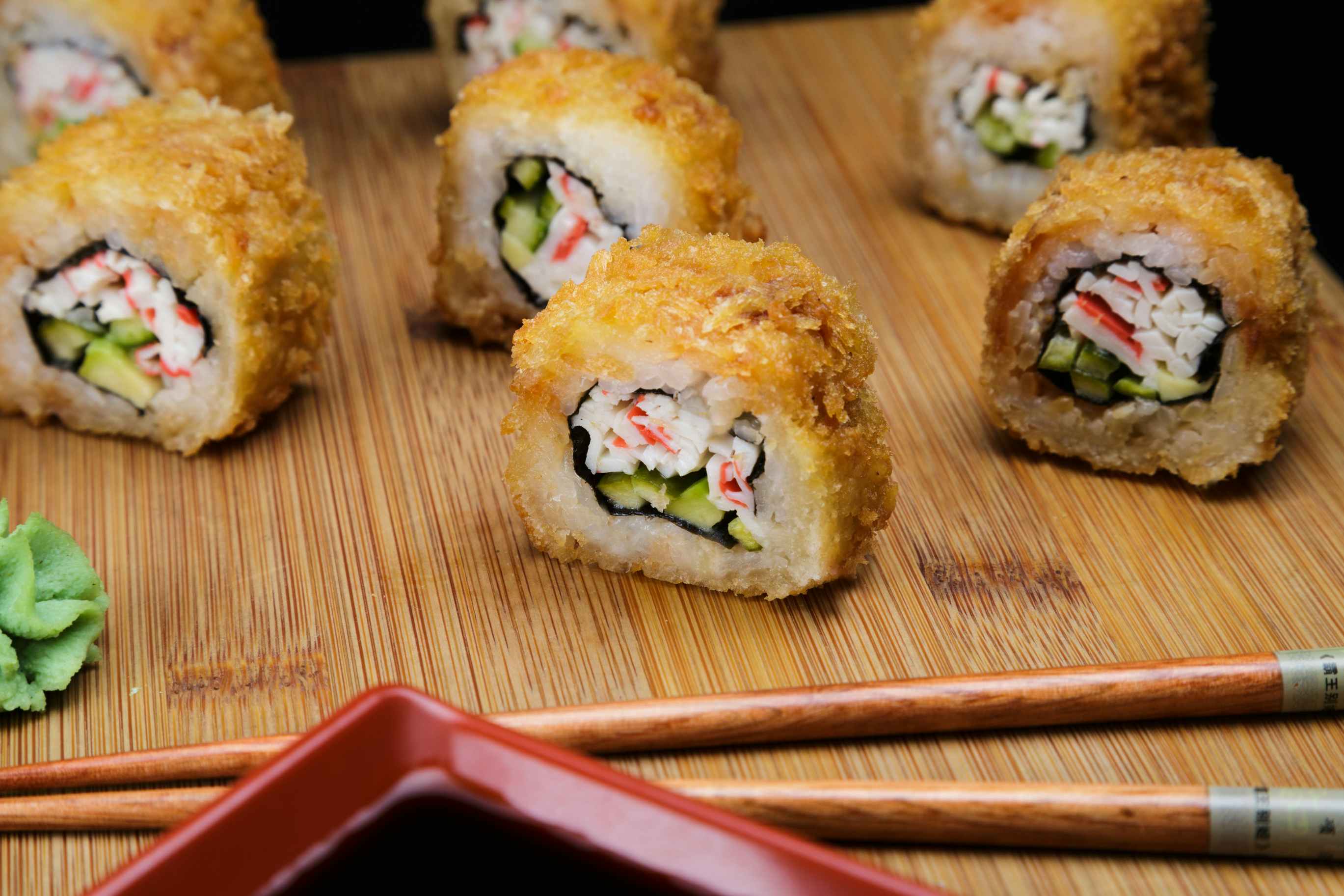 Fried sushi on a wooden board