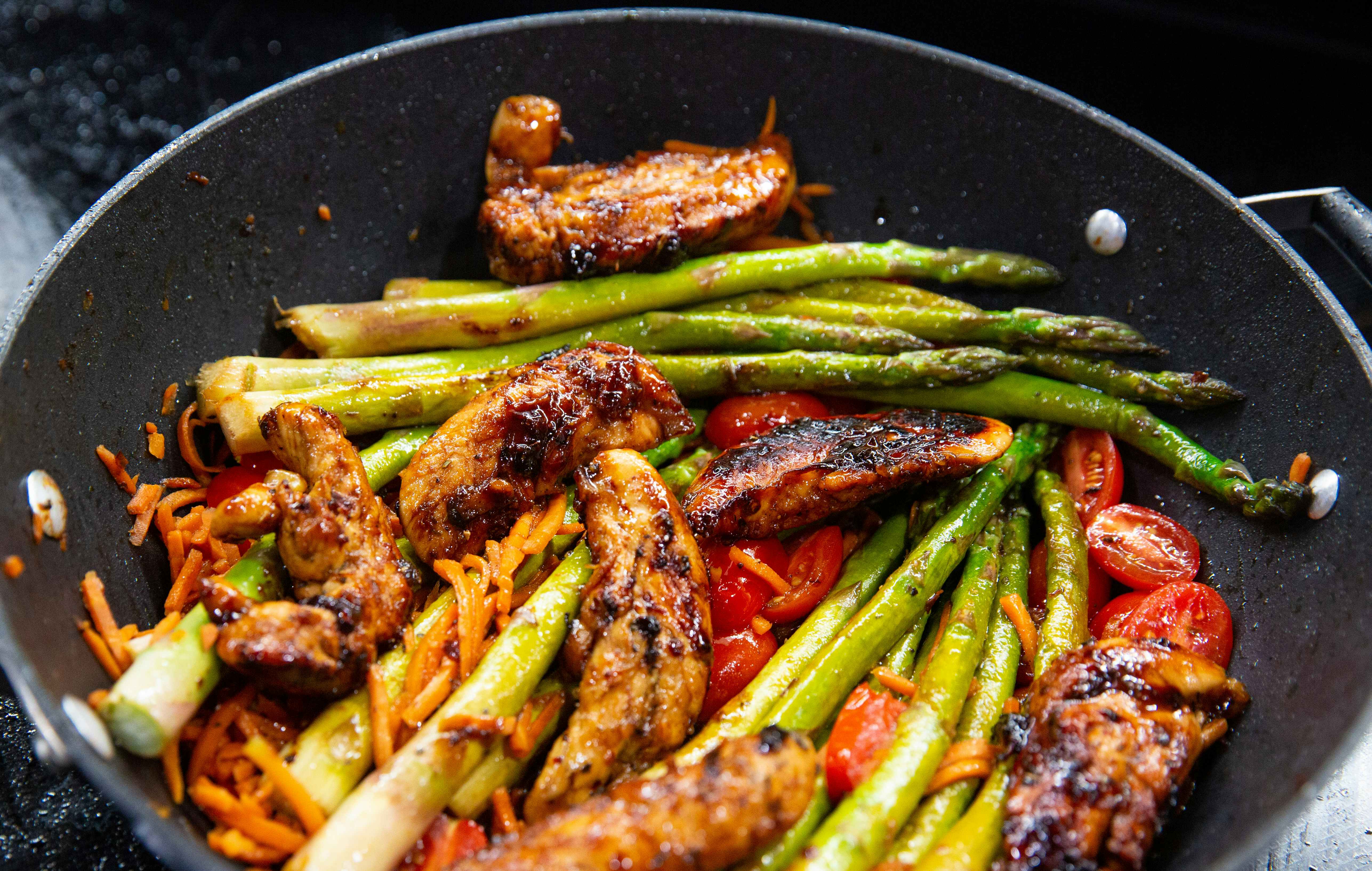 one-pot chicken balsamic dinner skillet with tomatoes and asparagus