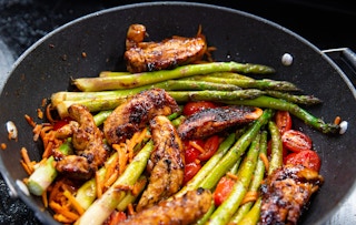 one-pot chicken balsamic dinner skillet with tomatoes and asparagus