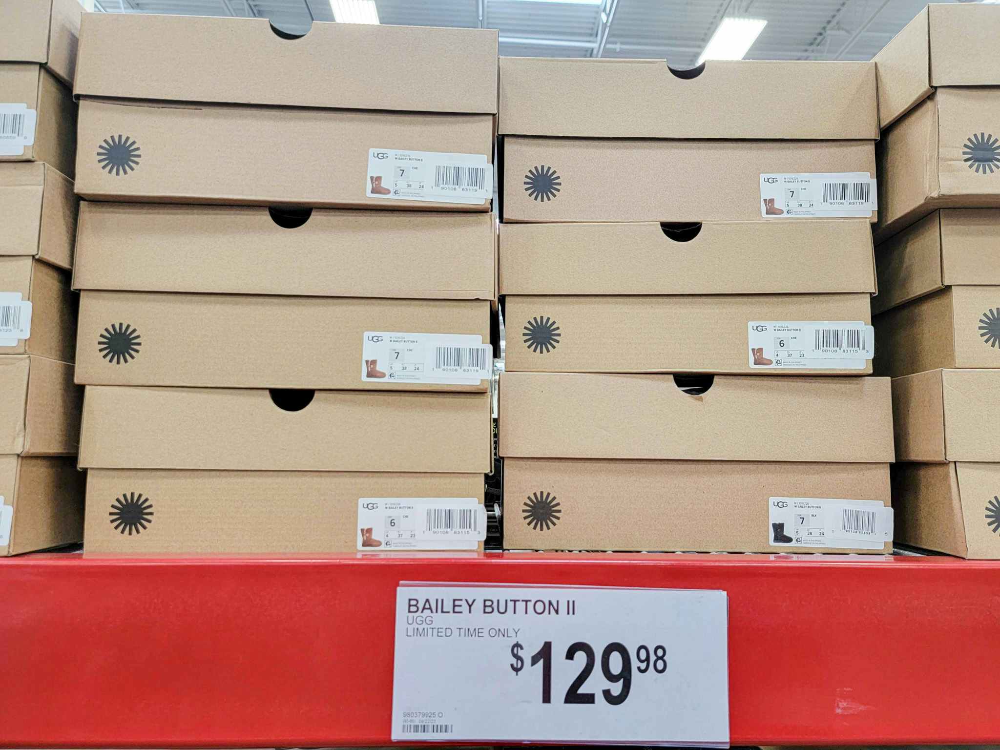 ugg boot boxes by a sign for $129.98