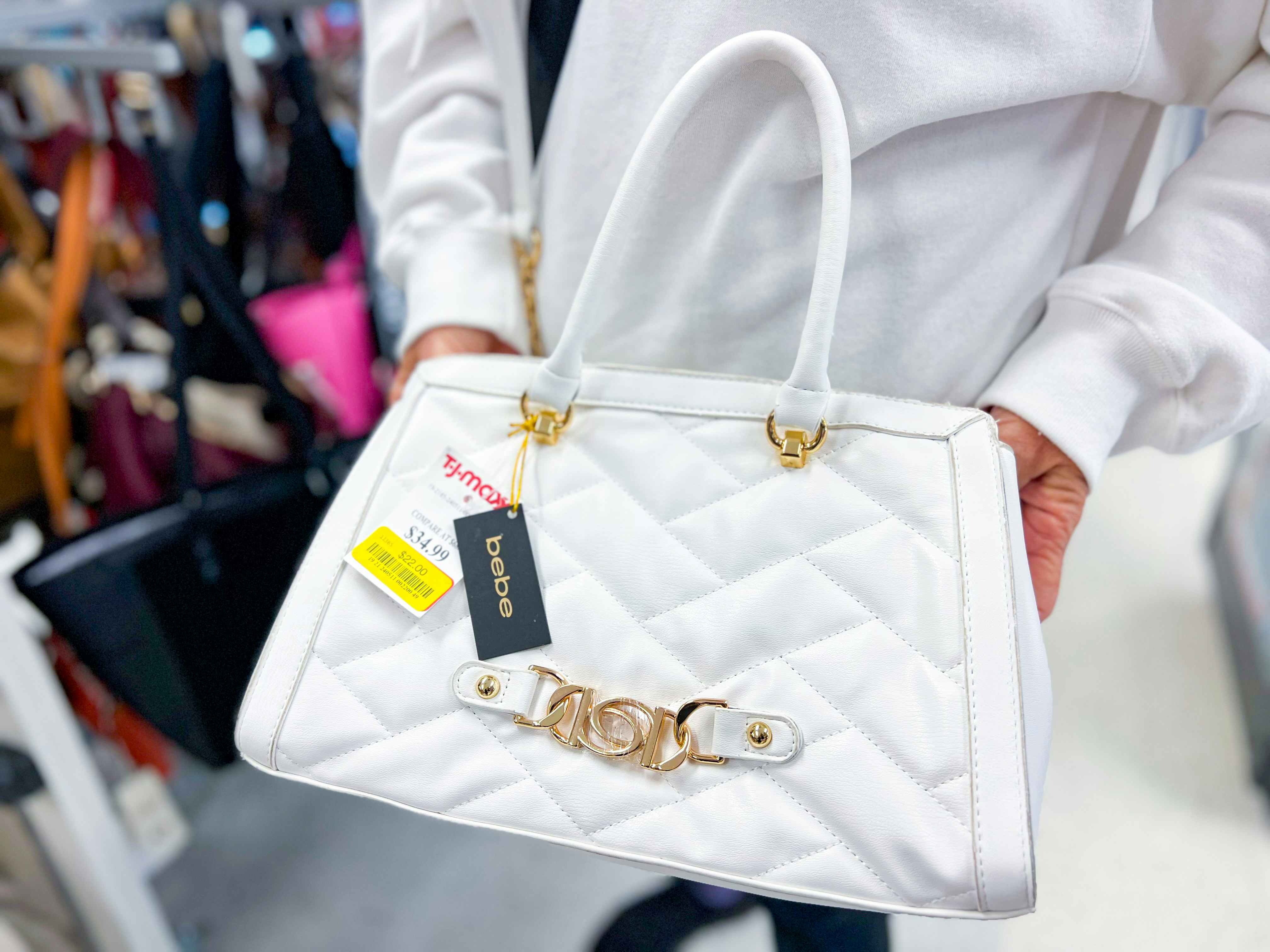 a clearance purse being held in store 