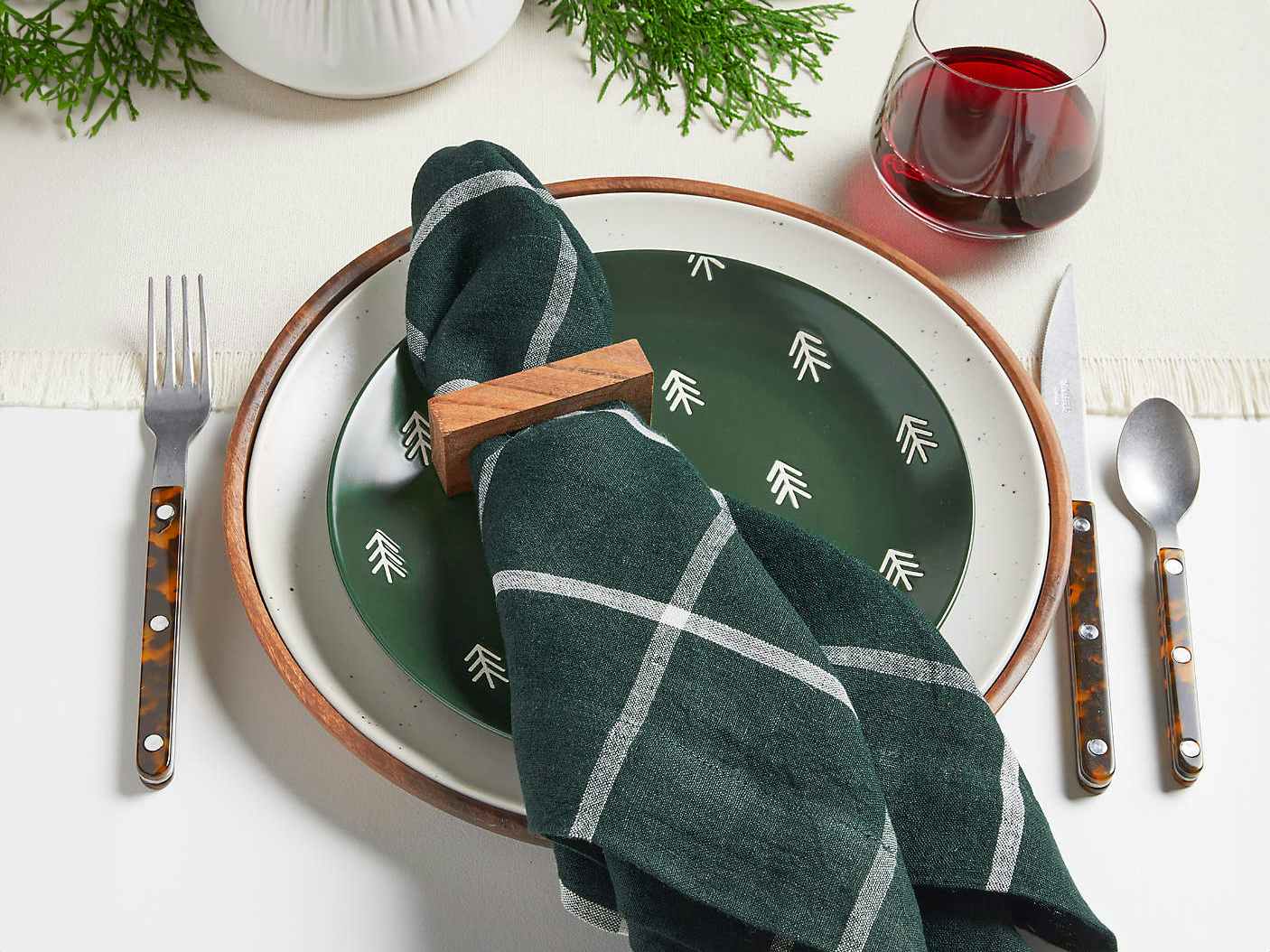 green holiday cloth napkins and place setting at table