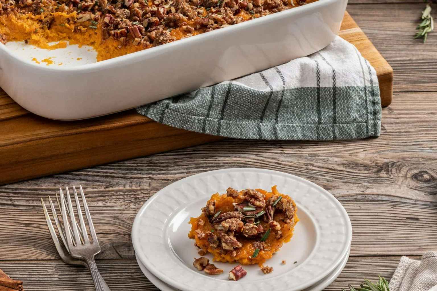sweet potato casserole on a plate and in a serving dish