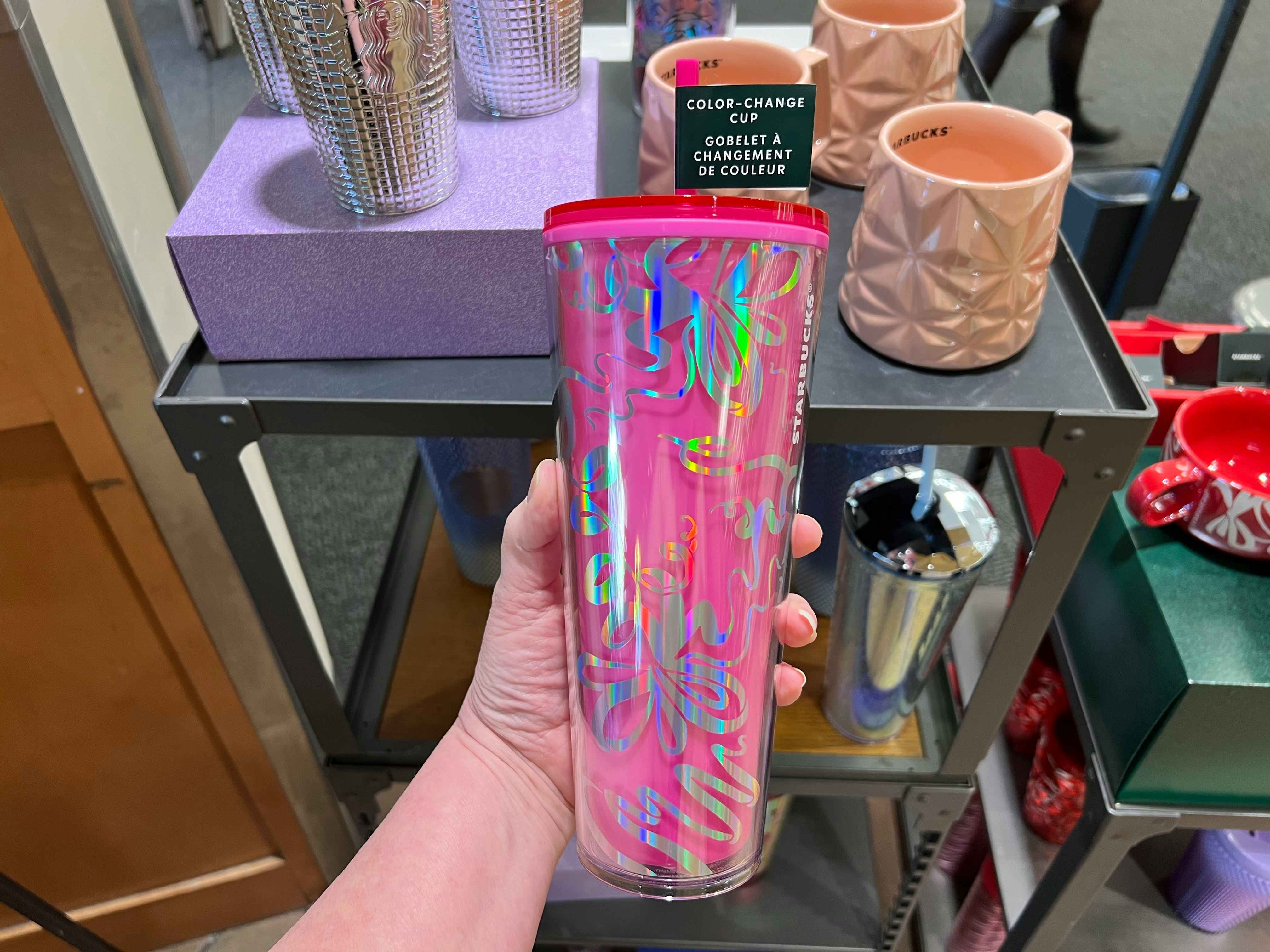 https://prod-cdn-thekrazycouponlady.imgix.net/wp-content/uploads/2023/12/starbucks-winter-cups-pink-ribbon-color-changing-tumbler-1701974098-1701974098.jpg?auto=format&fit=fill&q=25